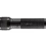 a black flashlight with a white background