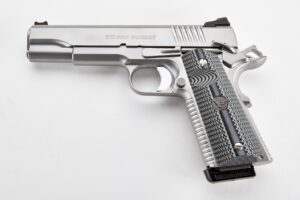 a silver handgun with a black grip